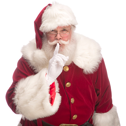 Portrait of the Real Santa Claus gesturing to keep quiet